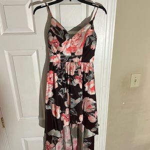 The dress is a brown/black with pink , & gray . Only worn once .